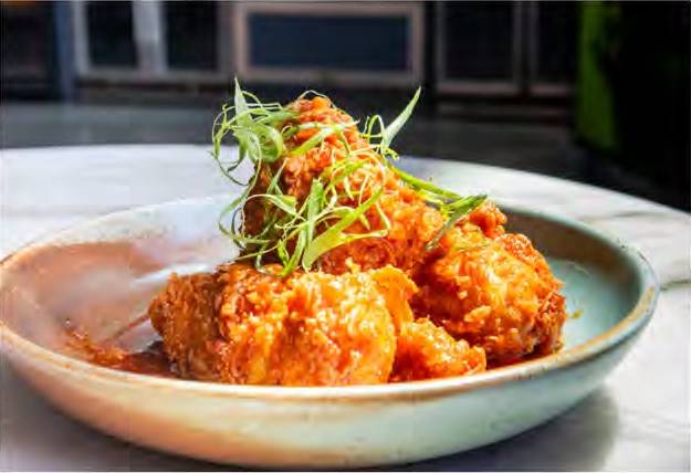 A plate of food with some type of meat.